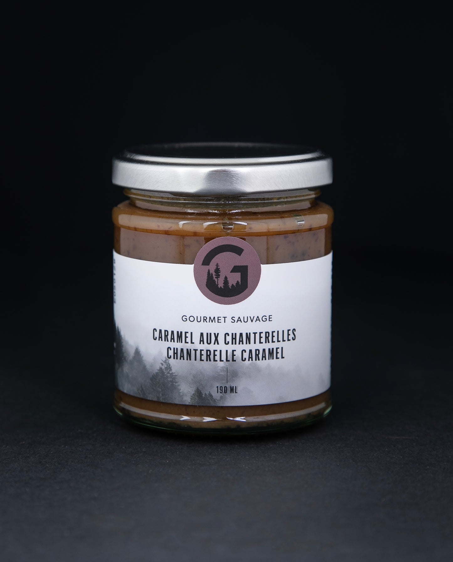 Clear glass jar with metal screw top lid containing chantelle caramel by