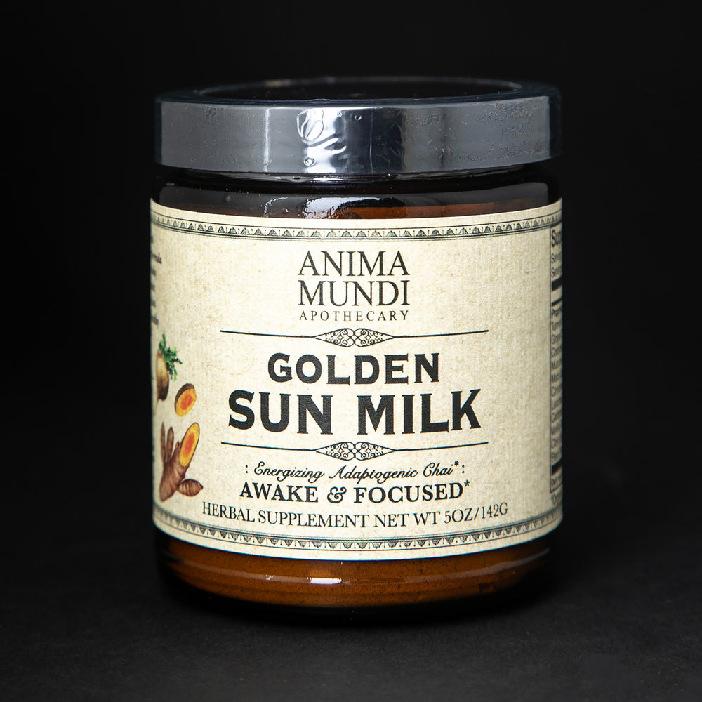 Amber glass jar with black lid and tan label. The jar contains Anima Mundi's "Golden Sun Milk" herbal supplement.
