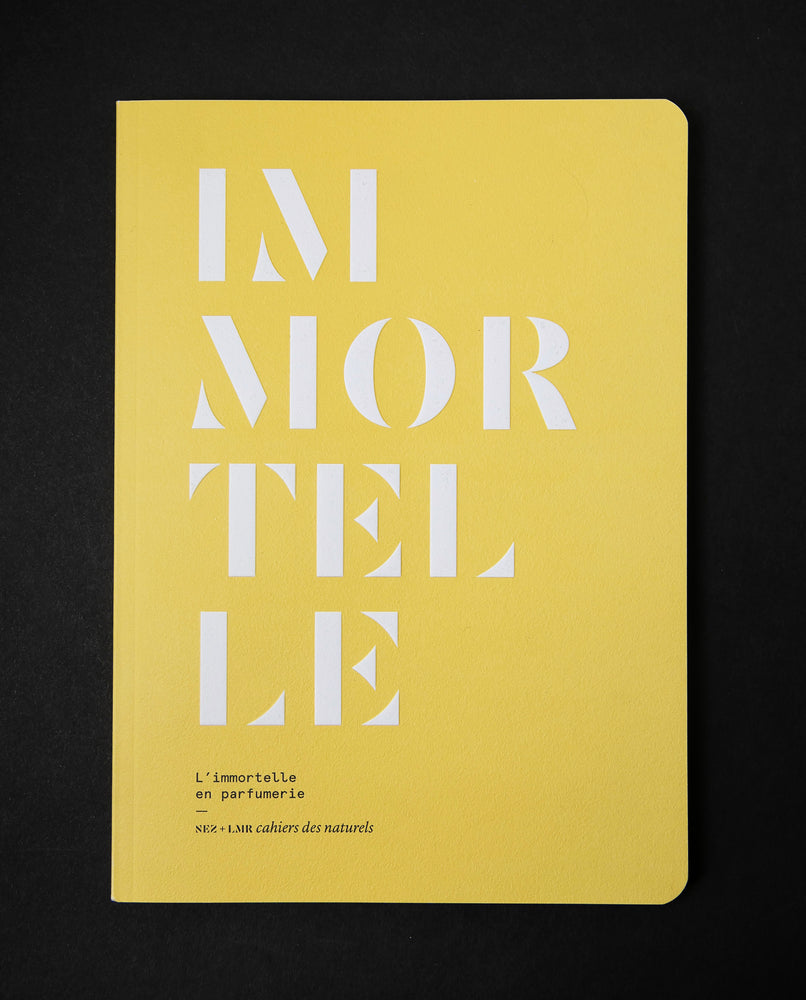 The book "l'imortelle en parfumerie" on black background. The cover is canary yellow and reads "IMORTELLE" in bold white graphic text.