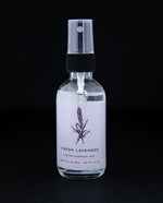 2oz clear glass bottle of Rowan & Sage's "Fresh Lavender" hydrosol. The label on the bottle is a light lavender purple colour.