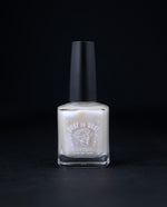 "Moonstone" nail polish by Death Valley Nails. The polish is an opalescent cream colour.