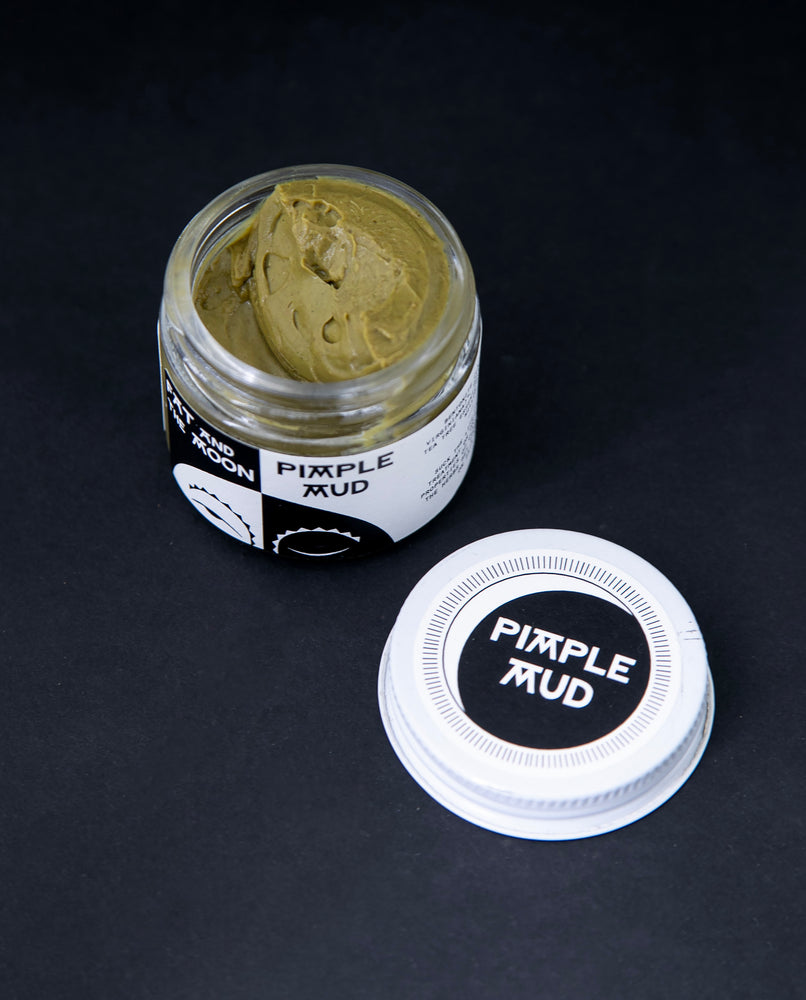opened glass jar of Fat and the Moon's "Pimple Mud", revealing a thick yellowy green clay-based paste