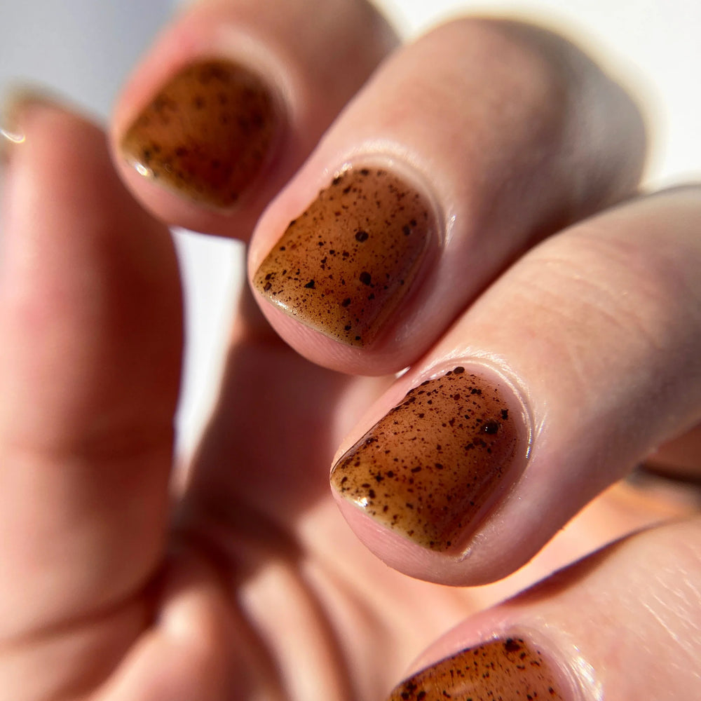 Close up of nails painted with Death Valley Nails' "Reishi" nail polish