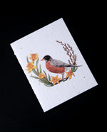 Greeting card with illustration of a robin surrounded by daffodils.