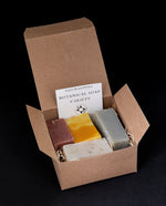 open gift box, revealing four colourful slices of Naturasophia botanical soap