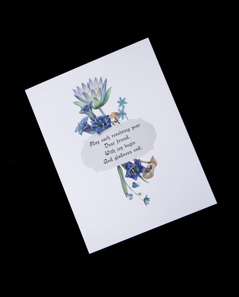 Victorian-inspired greeting card with illustration of blue lotus and other blue botanicals.