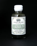 4oz clear glass bottle of Anima Mundi's "Viridem" herbal supplement. The label is ornate and white and mint coloured 