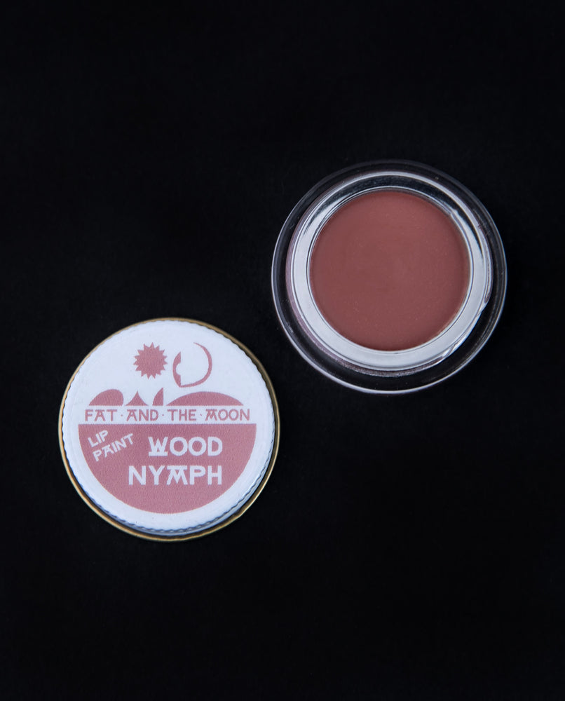 open glass pot of Fat and the Moon "Wood Nymph" lip paint, revealing a dusty rose lip colour