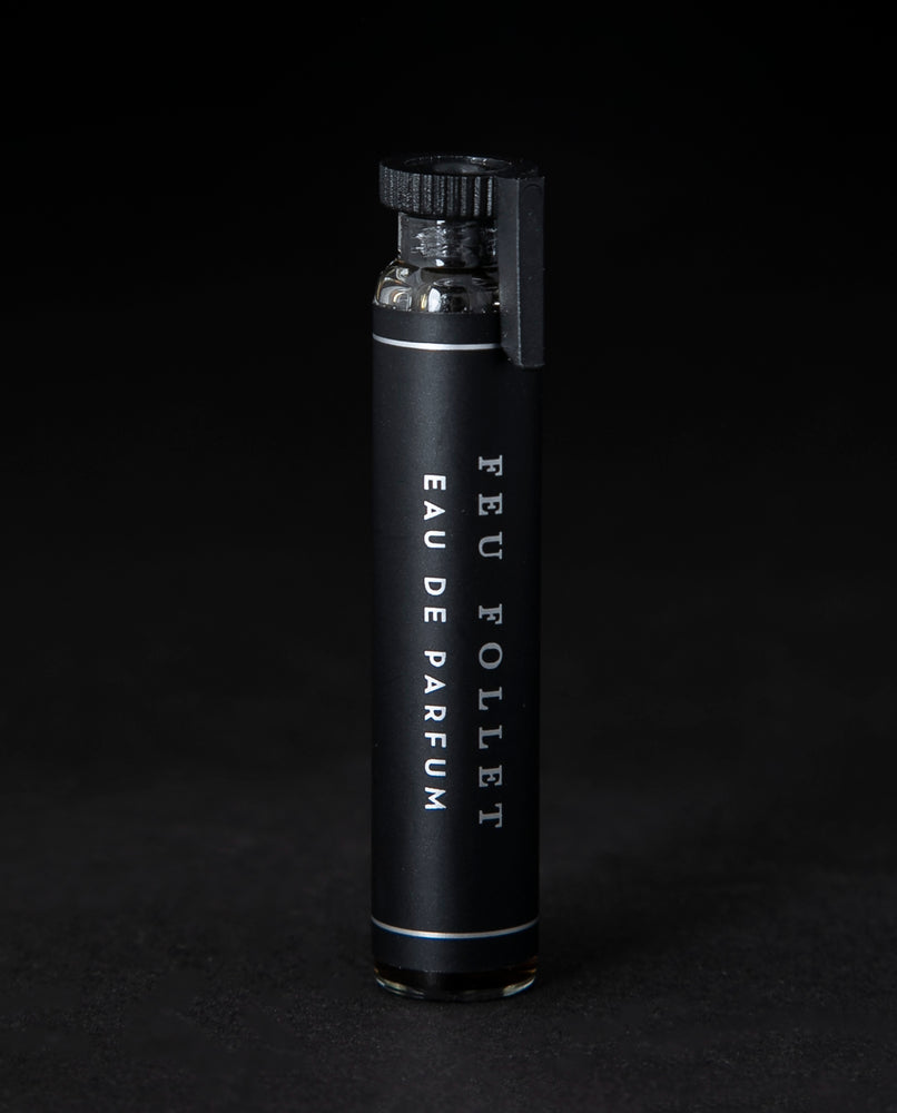 2ml glass sample vial of LVNEA's Feu Follet natural perfume on black background