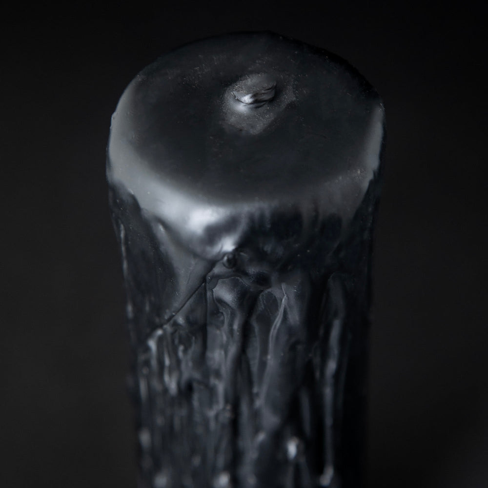 
                      
                        Close of the top wick portion of RITUAALIA'S black beeswax pillar candle
                      
                    
