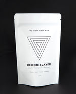 White 40g resealable bag with upside down triangle illustration, containing The New New Age's "Demon Slayer" herbal tea 