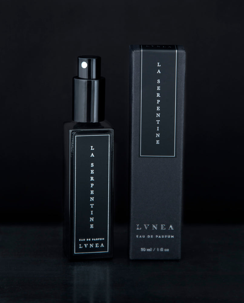 A fruity, leathery, unisex chypre fragrance by natural and botanical perfume brand LVNEA with notes of peach, osmanthus, patchouli, labdanum, and oakmoss. Presented in a 30ml black glass bottle, the label reads LA SERPENTINE EAU DE PARFUM.