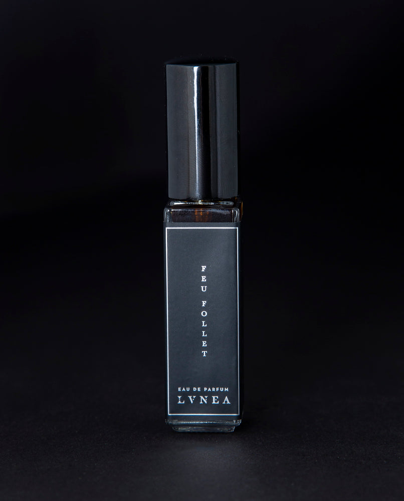 8ml clear glass bottle of LVNEA’s Feu Follet natural perfume on black background