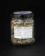 jar of herbal tea blend, showing french label which reads "Dragon Douillet" 