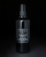 100ml black glass bottle of LVNEA's Yarrow Hydrosol on black background