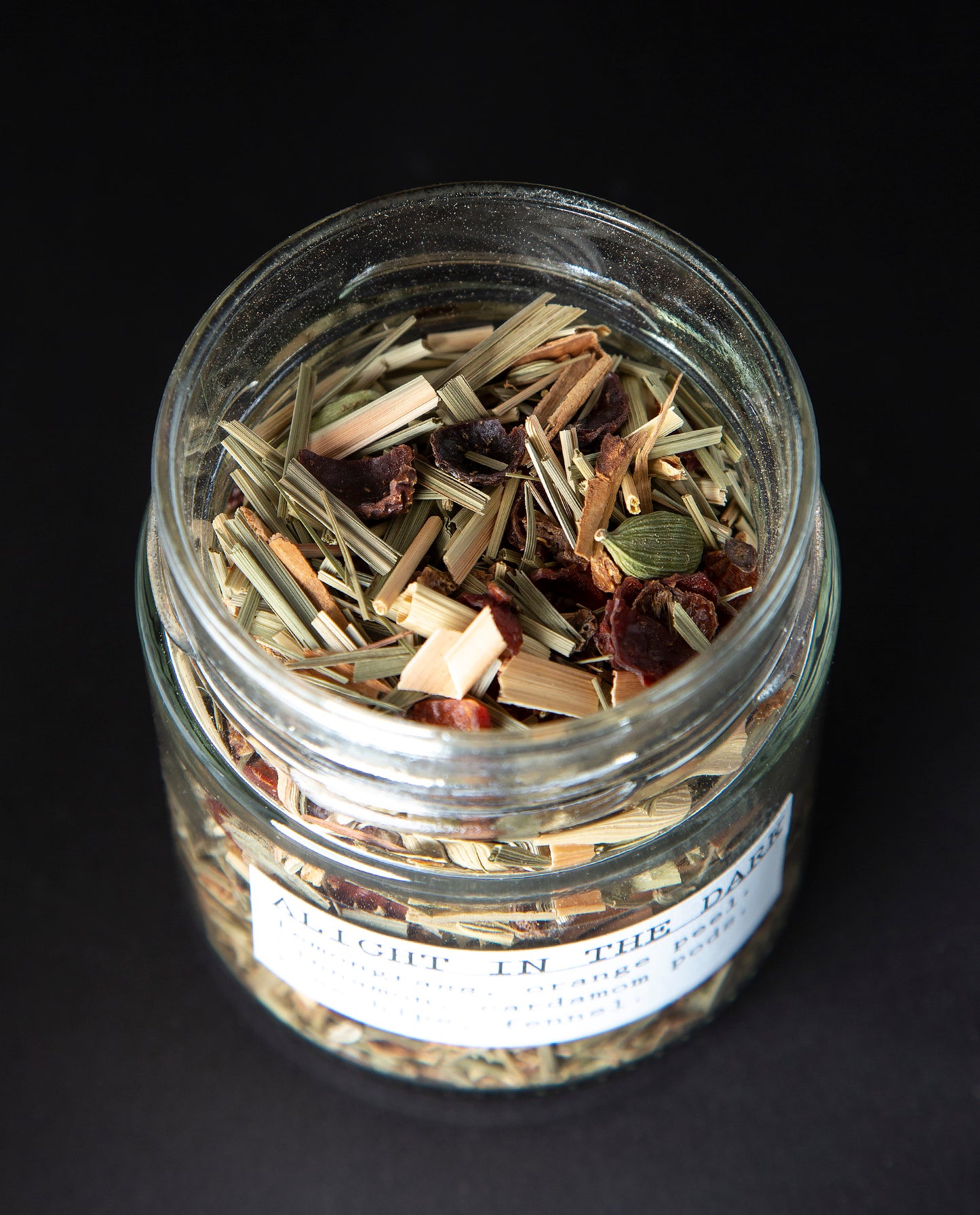 Open jar of blueberryams' 