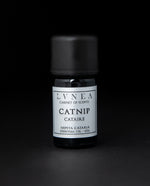 5ml black glass bottle with silver label of LVNEA's catnip essential oil on black background