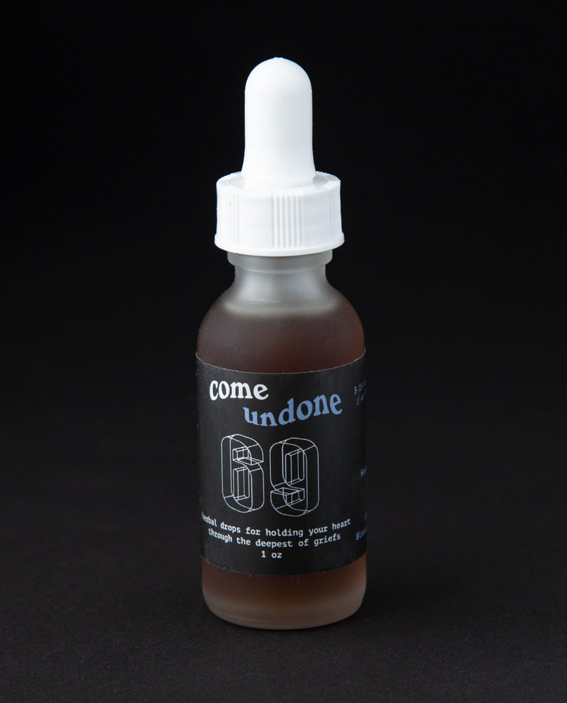 1oz clear frosted glass bottle with black label reading 'Come Undone". It contains a herbal tincture by 69herbs.