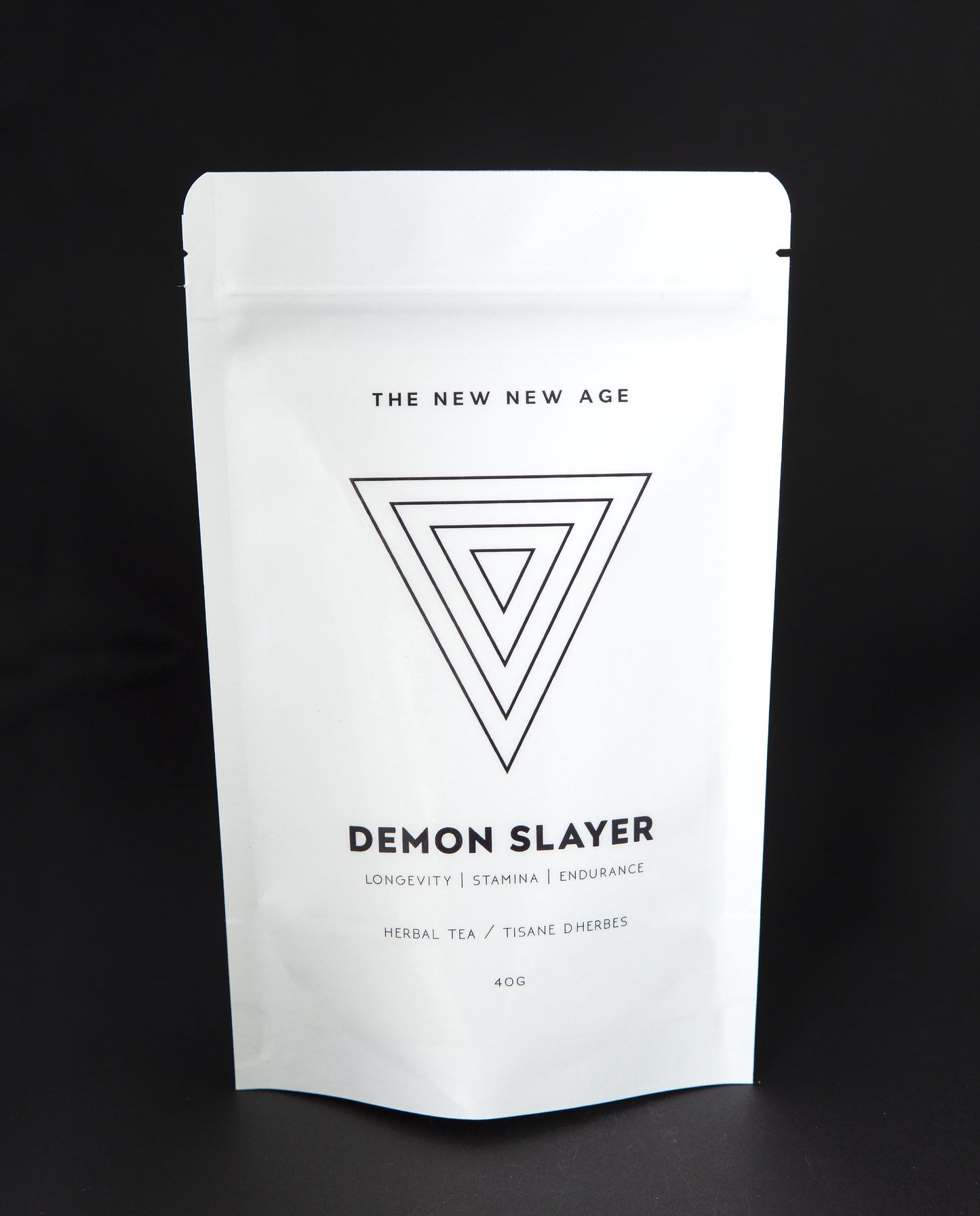 White 40g resealable bag with upside down triangle illustration, containing The New New Age's "Demon Slayer" herbal tea