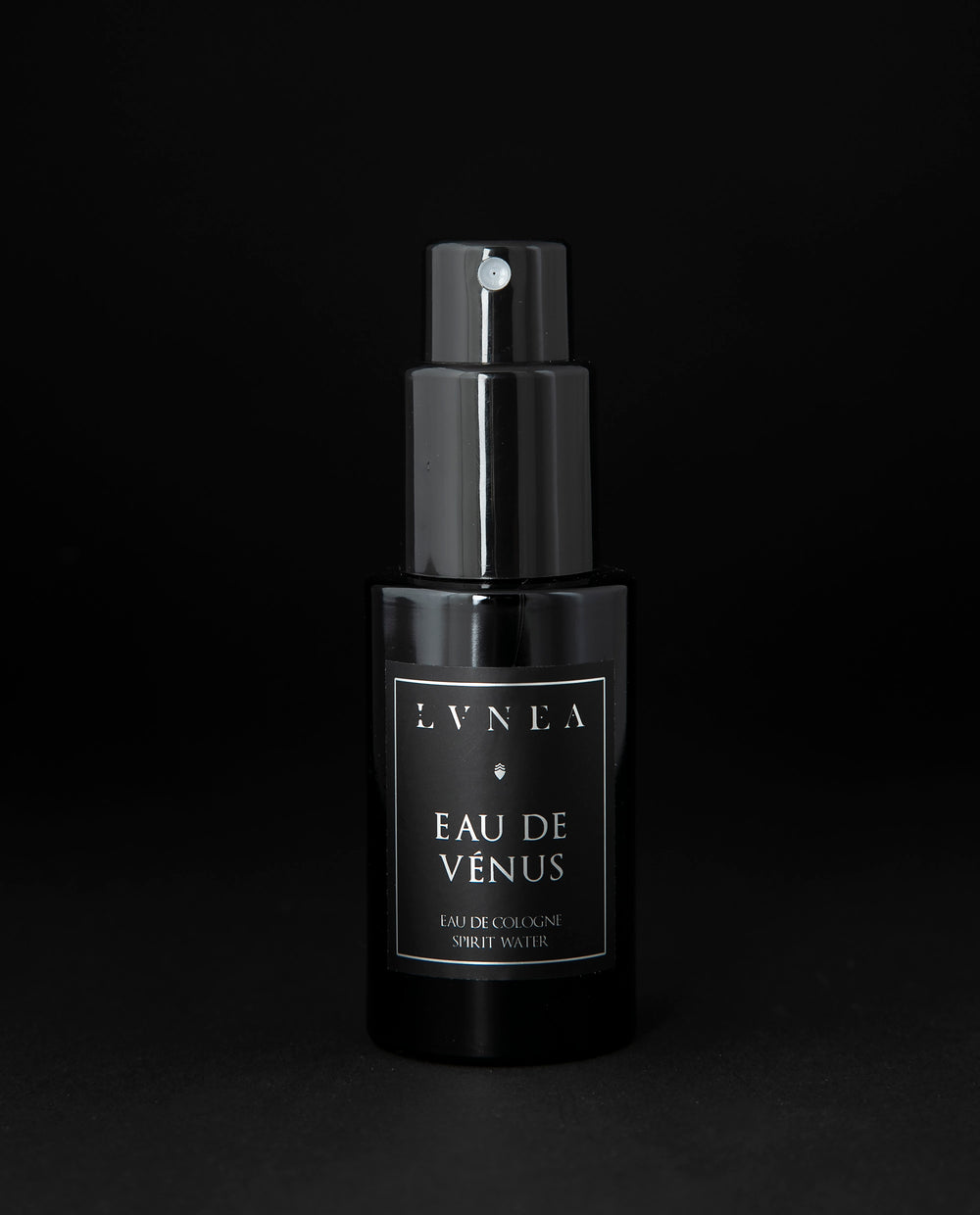 50ml black glass bottle of LVNEA’s Eau de Venus natural fragrance on black background