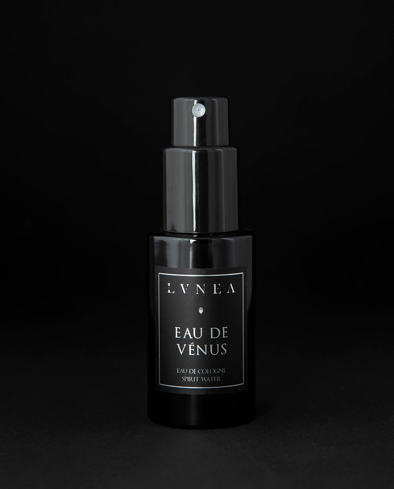 50ml black glass bottle of LVNEA’s Eau de Venus natural fragrance on black background