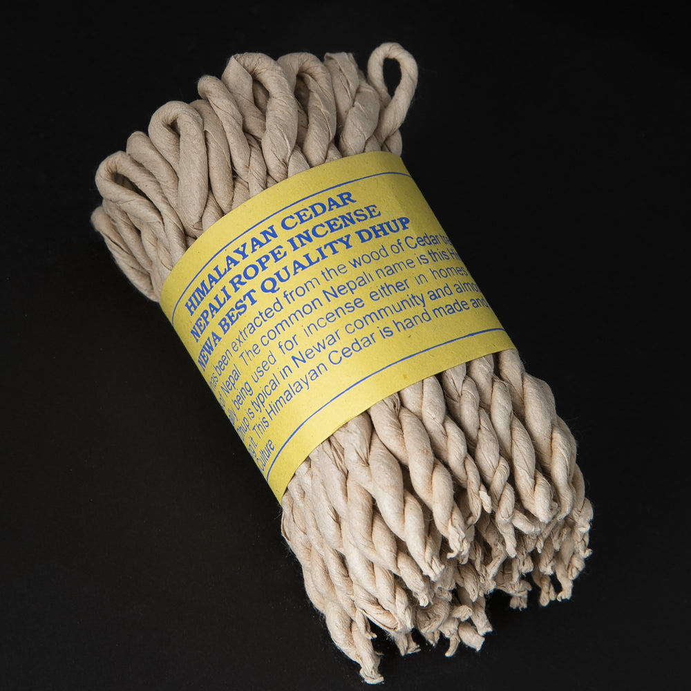 
                      
                        Bundle of himalayan cedar rope incense wrapped together with yellow paper label.
                      
                    