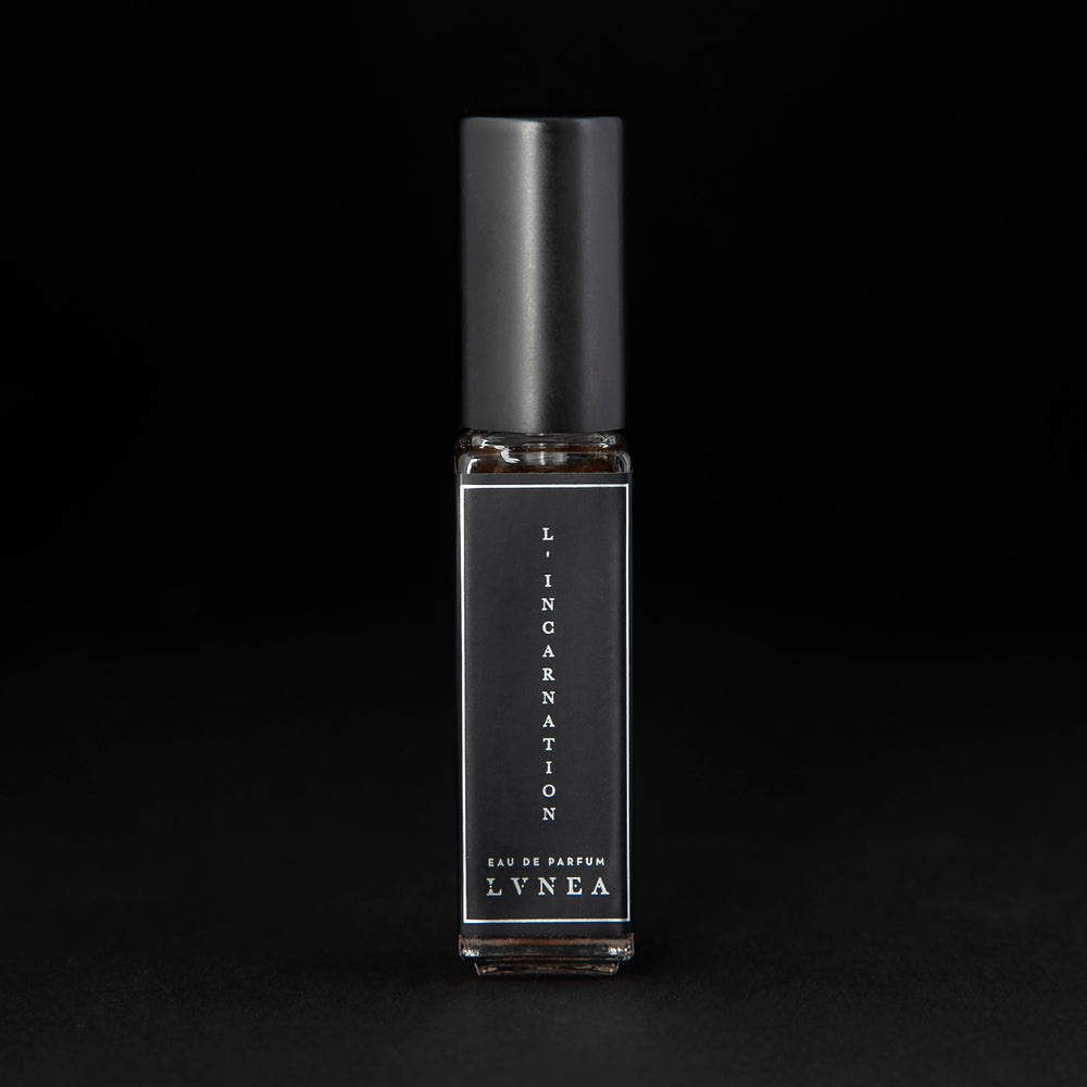 
                      
                        8ml clear glass bottle of LVNEA’s l'Incarnation natural perfume on black background
                      
                    