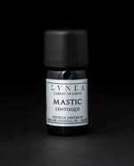 5ml black glass bottle of LVNEA's mastic essential oil on black background. The label on the bottle is silver.