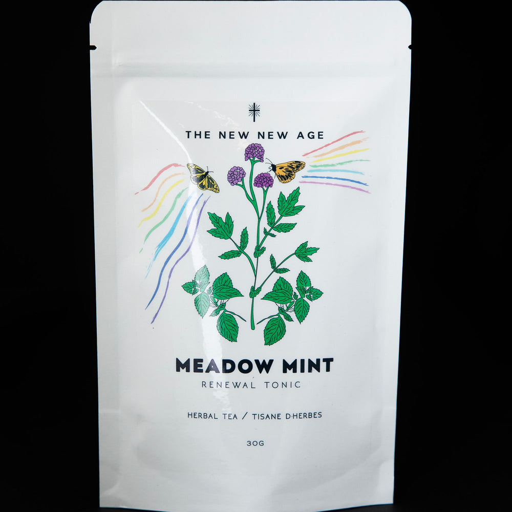 White resealable pouch of The New New Age's "Meadow Mint" herbal tea. The bag features a colourful illustration of flowering mint.