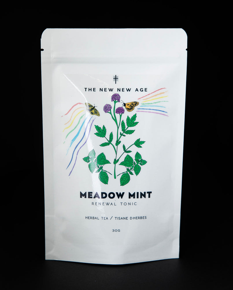 White resealable pouch of The New New Age's "Meadow Mint" herbal tea. The bag features a colourful illustration of flowering mint.