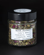 clear glass jar filled with blueberryjams' "Moon Alchemy" herbal tea blend