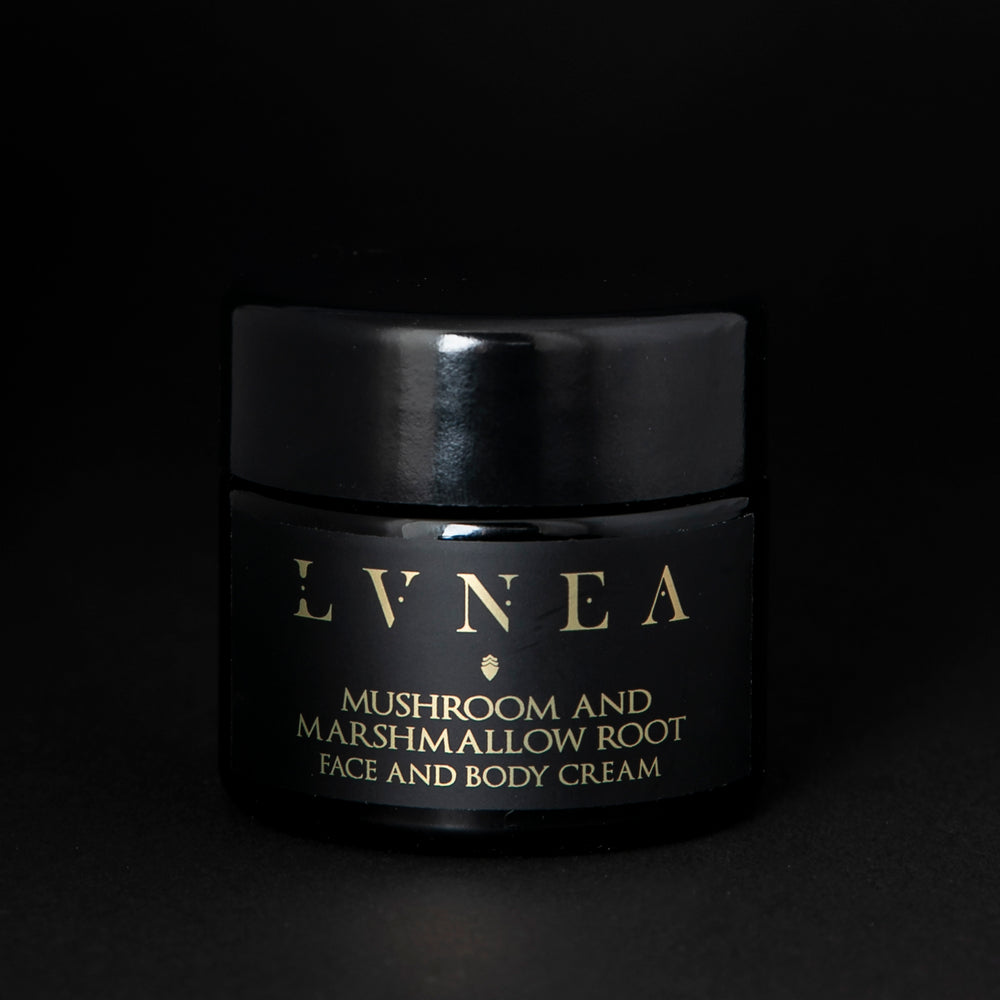 
                      
                        LVNEA's "Mushroom & Marshmallow" botanical face and body cream housed in a 50ml black glass jar on black background.
                      
                    