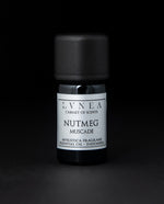 5ml black glass bottle of LVNEA's nutmeg essential oil on black background. The label on the bottle is silver.