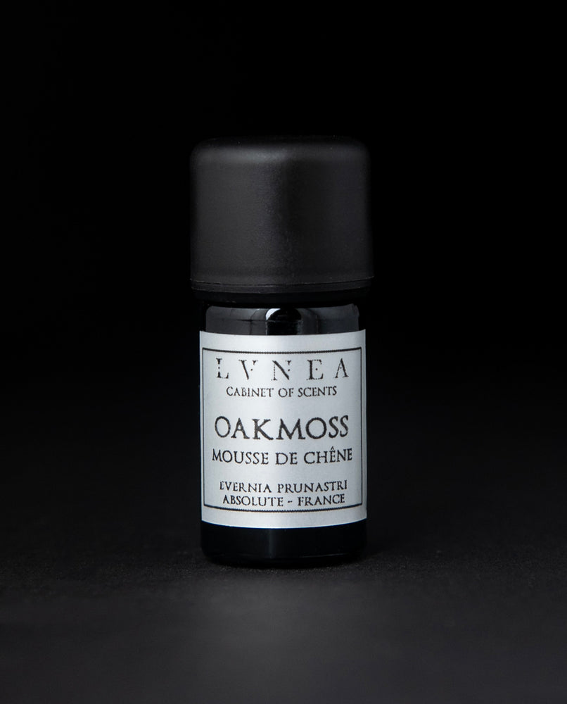 5ml black glass bottle of LVNEA's oakmoss absolute on black background. The label on the bottle is silver.