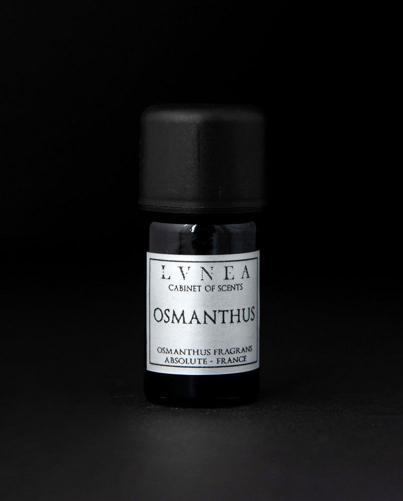 5ml black glass bottle of LVNEA's osmanthus absolute on black background. The label on the bottle is silver.