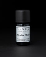 5ml black glass bottle of LVNEA's palma rosa essential oil on black background. The label on the bottle is silver.
