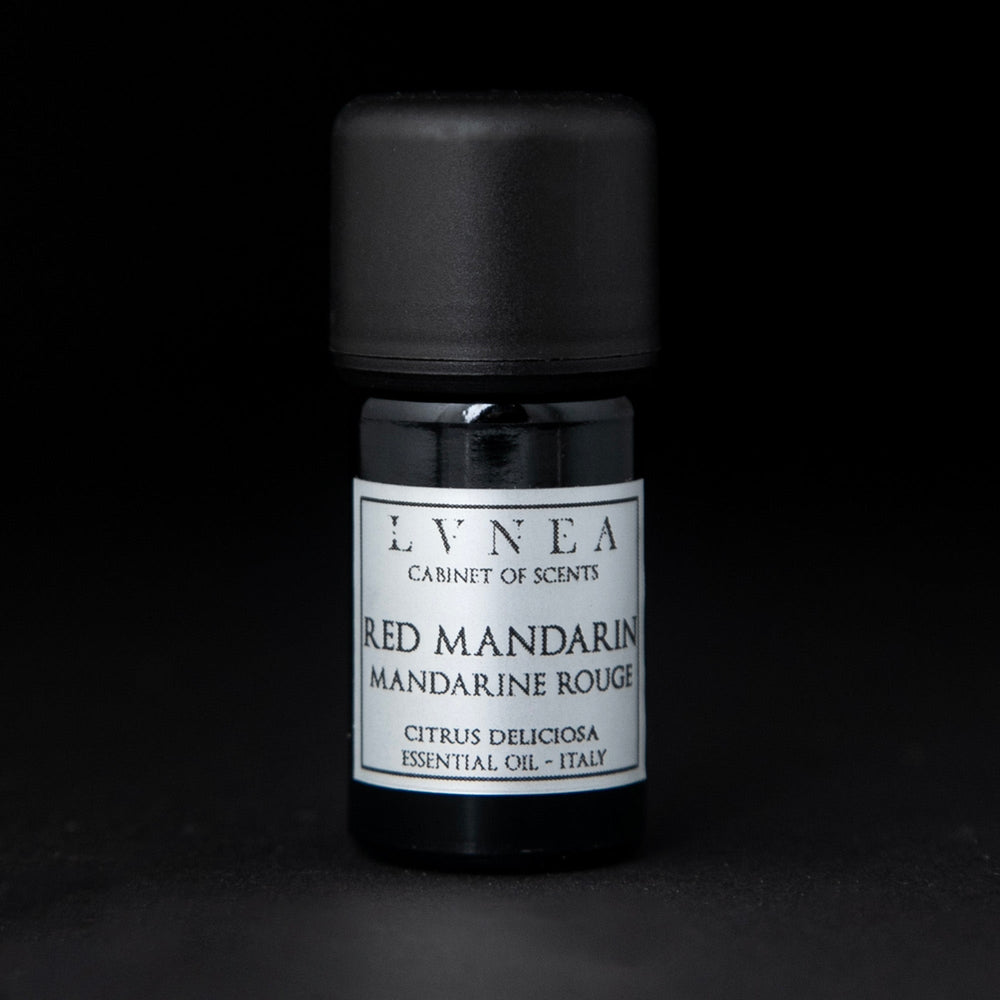 
                      
                        5ml black glass bottle of LVNEA's red mandarin essential oil on black background. The label on the bottle is silver.
                      
                    