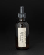 Amber glass bottle with dropper top filled with blueberryjams' "Reishi & Lion's Mane" herbal tincture