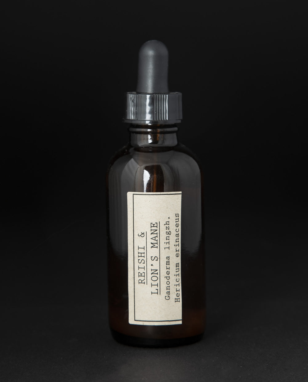 Amber glass bottle with dropper top filled with blueberryjams' 