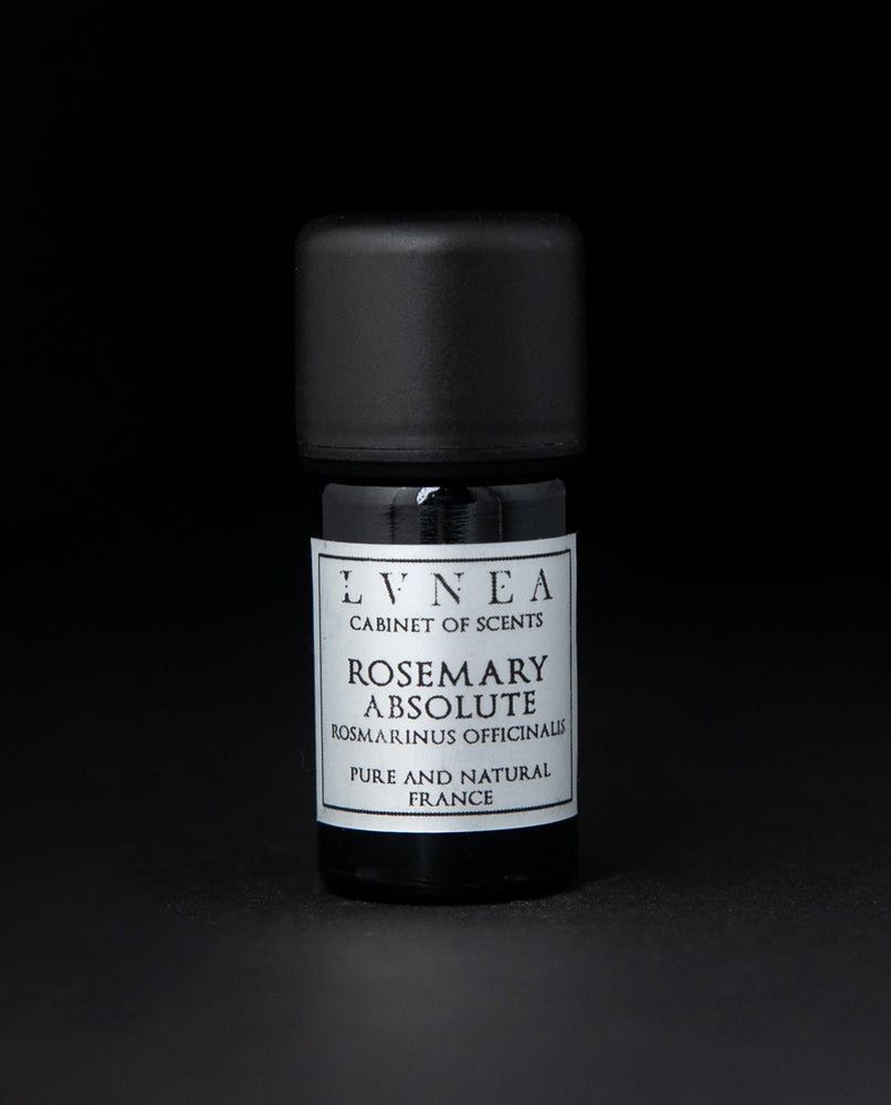 5ml black glass botttle of LVNEA's rosemary absolute on black background. The label on the bottle is silver.