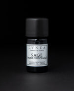 5ml black glass botttle of LVNEA's sage essentail oil on black background. The label on the bottle is silver.
