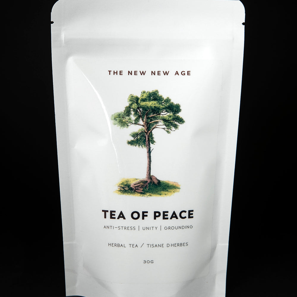 white resealable pouch of The New New Age's "Tea of Peace" herbal tea blend. There is an illustration of a tree on the bag.