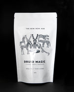 White resealable pouch of The New New Age's "Druid Magic" herbal tea. There is an illustration of the Celtic god Cernunnos on the package.