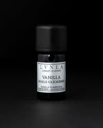 5ml black glass bottle of LVNEA's vanilla oleoresin on black background. The label on the bottle is silver.