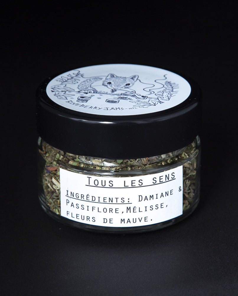 Clear glass jar of blueberryjams' "Tous les Sens" rolling blend.