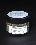 Clear glass jar of blueberryjams' "Wandering Star" rolling blend.